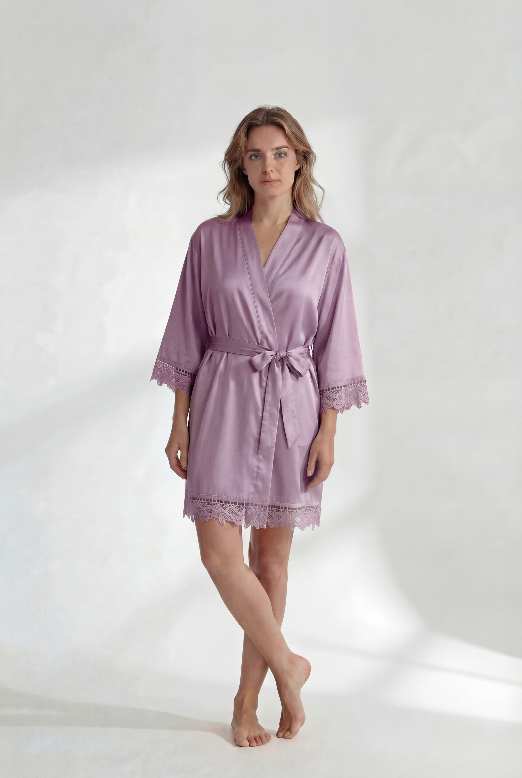 Woman wearing a light purple robe on a white background