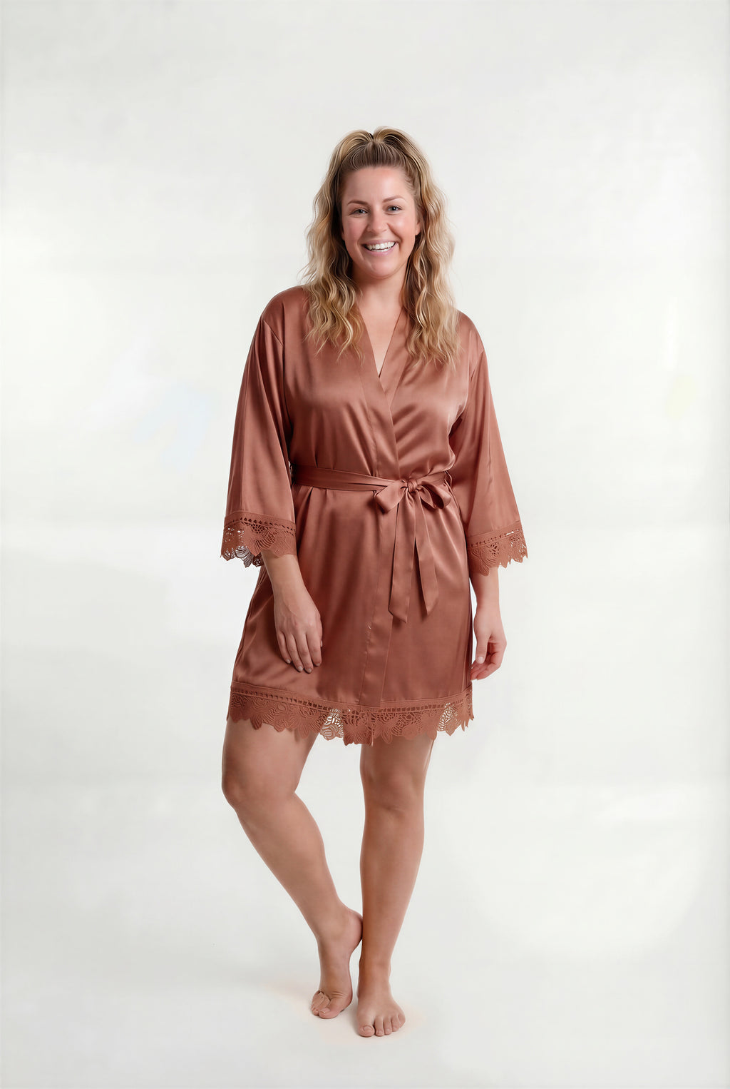 Woman wearing a brown robe on a white background