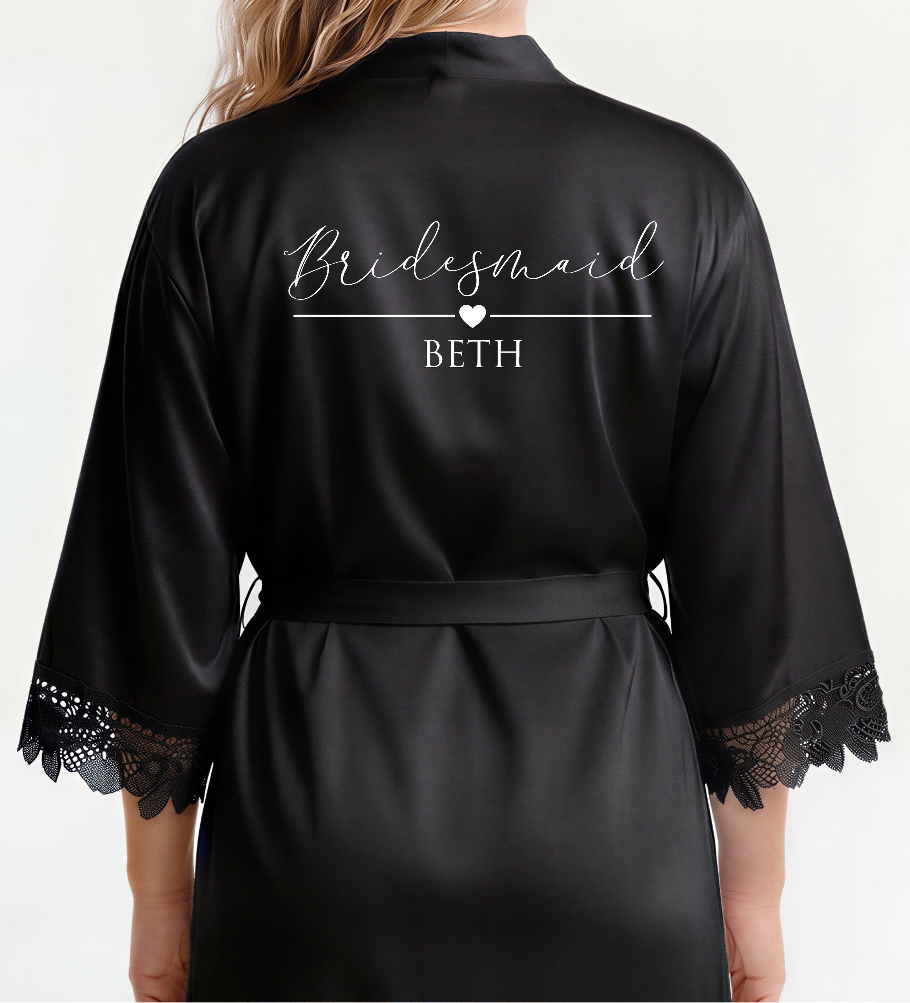 Black satin robe with 'Bridesmaid BETH' text on a white background