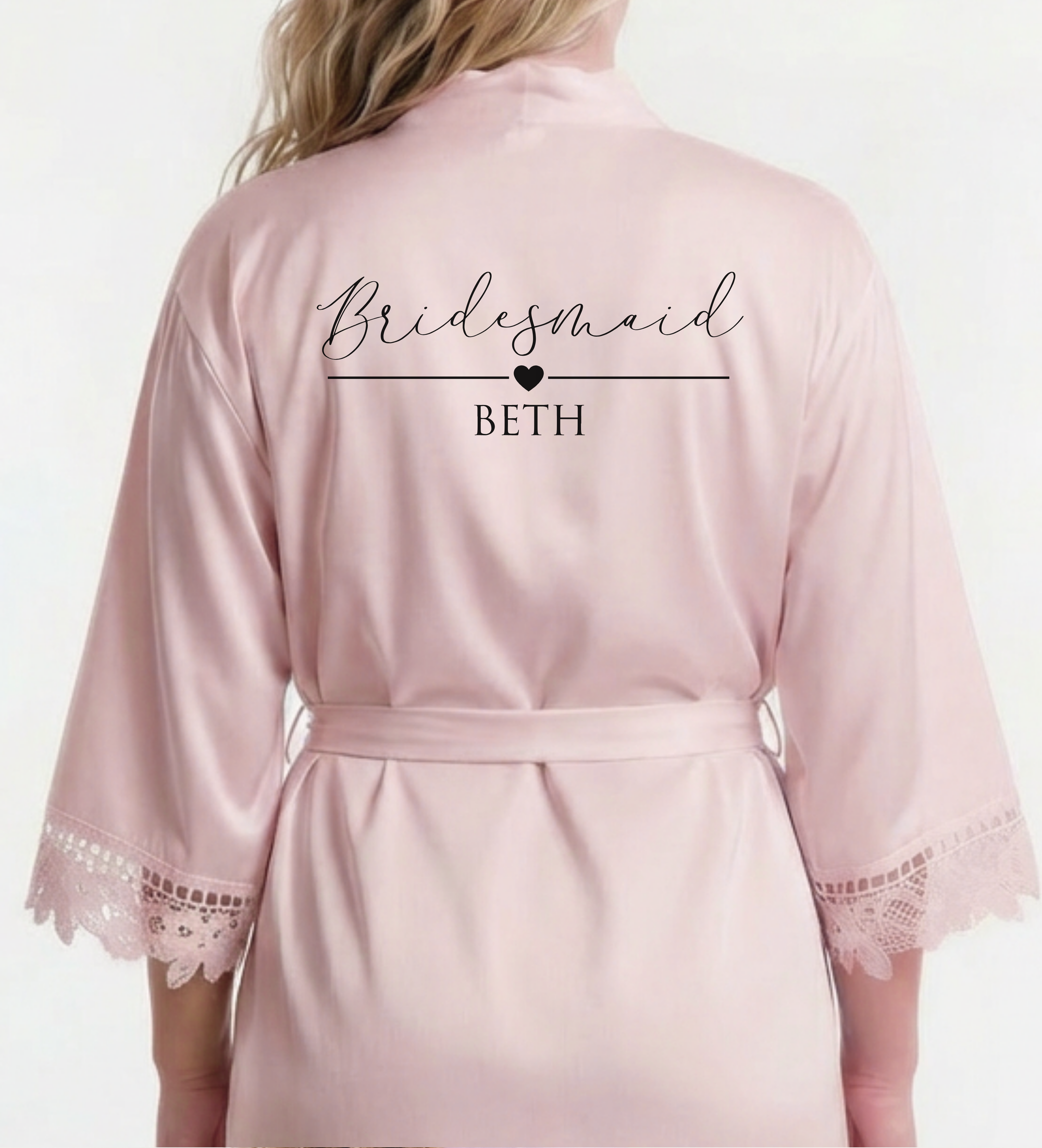Pink satin robe with 'Bridesmaid BETH' text on a white background