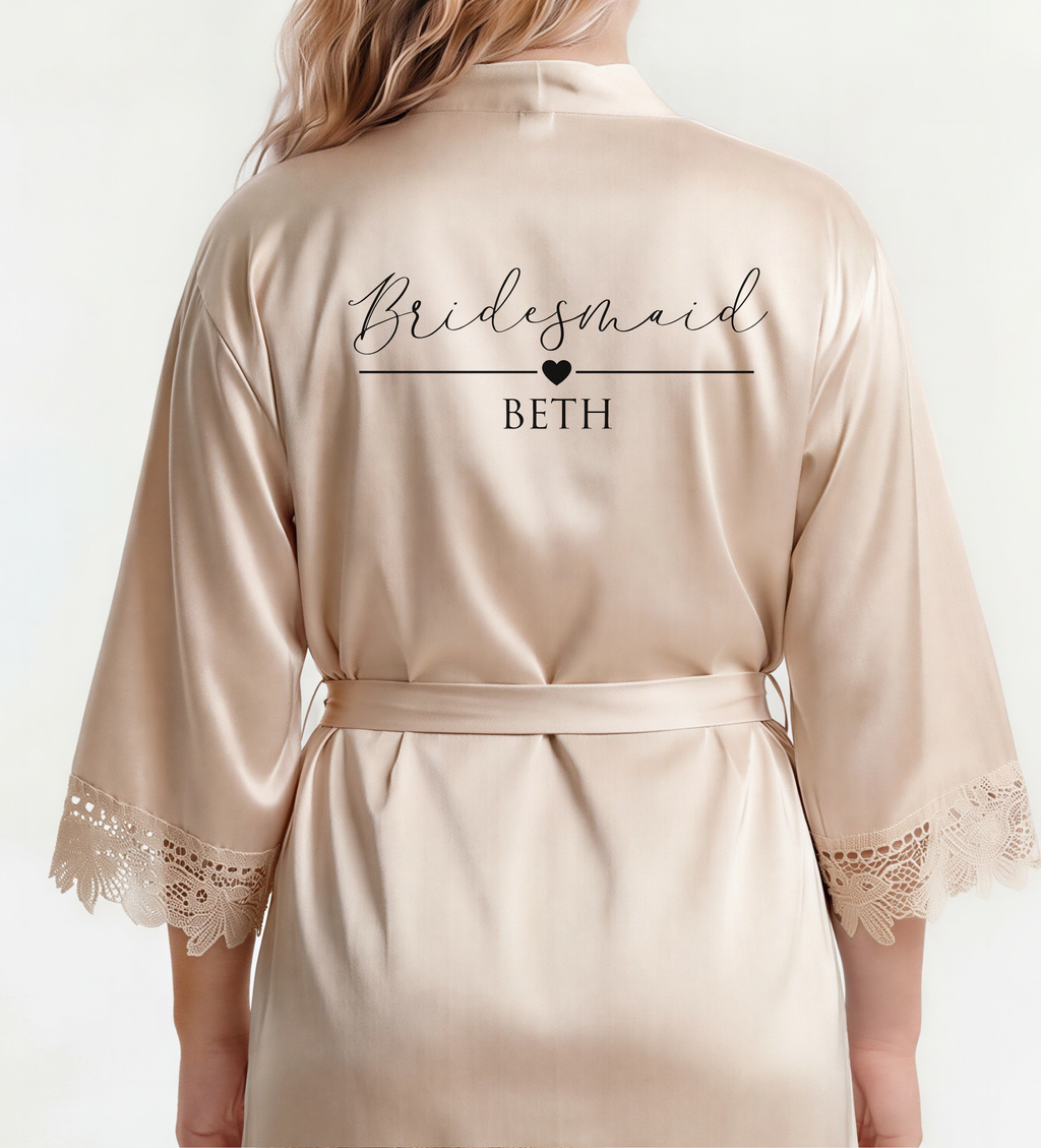 Beige satin robe with 'Bridesmaid BETH' text on a white background