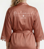 Brown satin robe with 'Bridesmaid BETH' text on a white background